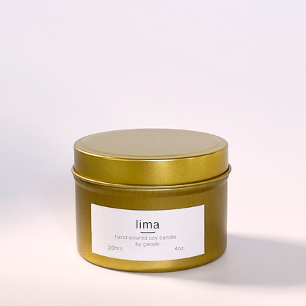 LIMA TRAVEL TIN SOY CANDLE (4oz / 135g) in gold tin, calming hand-poured soy candle helping families thrive.