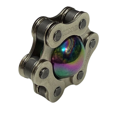Magic Ball Fidget by Kaiko featuring a rainbow-colored sphere encased in a silver metal chain frame for tactile play