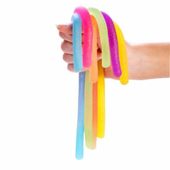 Hand holding colorful Pullie Pal Stretch Glitter Noodles sensory fidget toy helping families thrive with tools to calm connect and support