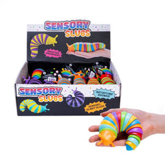 Sensory Slugs colorful fidget toy held in hand with display box of sensory slinks for calming and connection