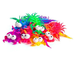 Bright colorful stretchy centipedes with big eyes in various vibrant shades for sensory play and stress relief.