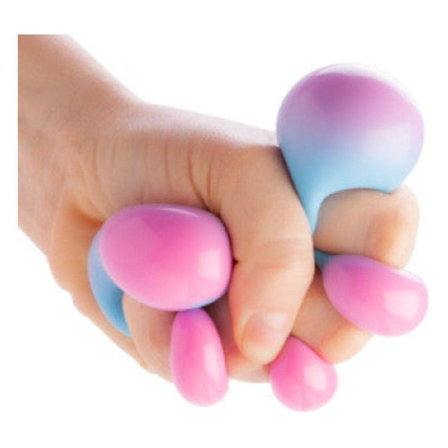Hand squeezing Smoosho's Colour Change Ball sensory fidget toy with pink and blue squishy bubbles.
