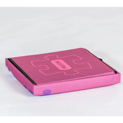 Folded pink Sensory Floor Tiles Storage Box with puzzle design, helping families thrive with tools to calm and connect.