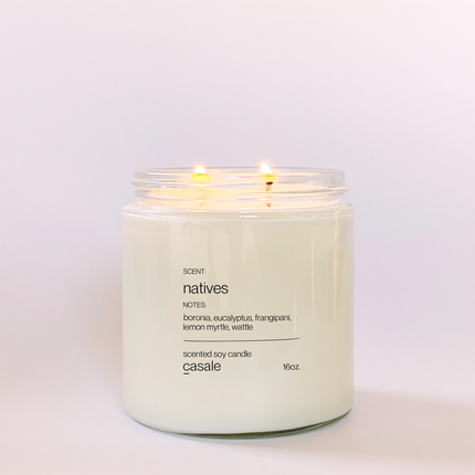 NATIVES DOUBLE WICKED SOY CANDLE (16oz / 453g) lit with calming sensory lighting, helping families thrive with tools to calm, connect and support