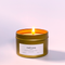 NATIVES TRAVEL TIN SOY CANDLE (4oz / 135g) lit, promoting calm and support for families to thrive.