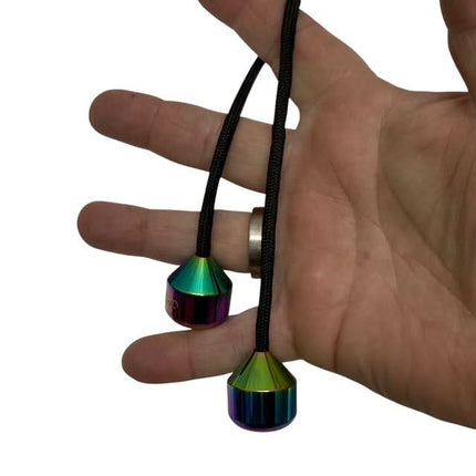 Skill Trick Set - Metal Oil Slick Begleri & Luxe Loop Fidget Set held in hand with colorful metal beads on black cord.