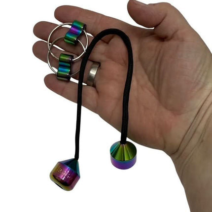 Hand holding Skill Trick Set - Metal Oil Slick Begleri & Luxe Loop Fidget Set with rainbow metal pieces and black cord