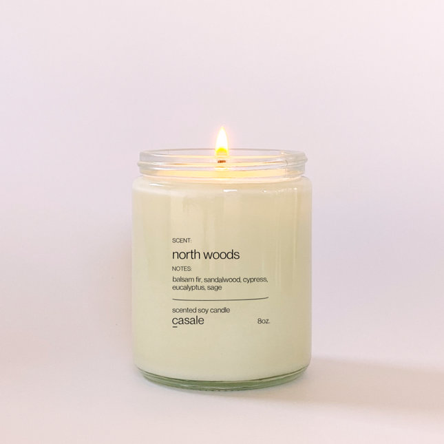 NORTH WOODS SINGLE WICKED SOY CANDLE (8oz / 226g) lit to create a calming and supportive sensory ambiance.