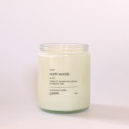 NORTH WOODS SINGLE WICKED SOY CANDLE (8oz / 226g) in clear jar with natural scent, helping families thrive with tools to calm, connect and support