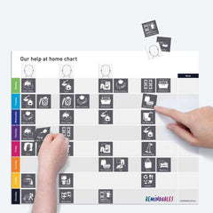 Our Help At Home Chart with daily task icons and hands placing magnetic activity pieces for organization