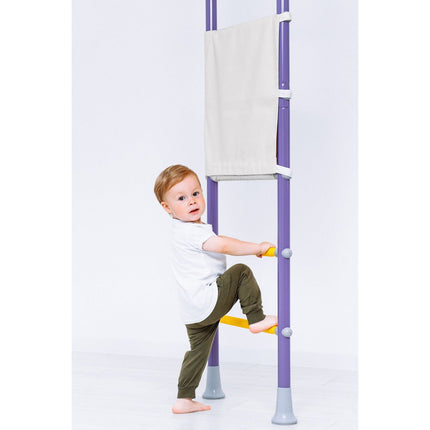 Child climbing purple wallbars fitted with Swedish Wallbars Safety Covers, supporting safe play and movement indoors.