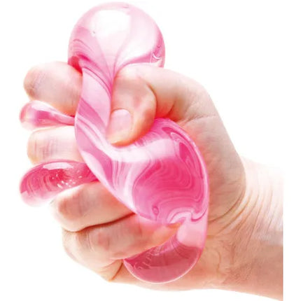 Schylling - Candy Swirl Nice Cube Nee Doh pink sensory squishy toy squeezed in a hand
