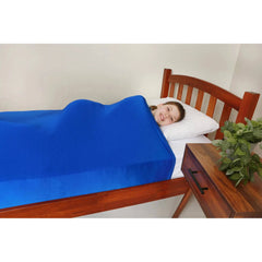 Child resting comfortably in bed wrapped in vibrant blue Lycra Bed Sheets helping families thrive with support.