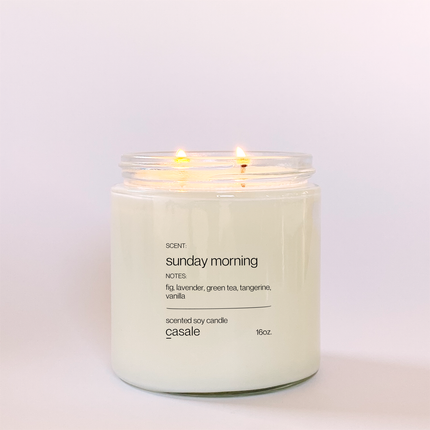 SUNDAY MORNING DOUBLE WICKED SOY CANDLE (16oz / 453g) lit, soft warm glow, helping families thrive with tools to calm, connect and support.