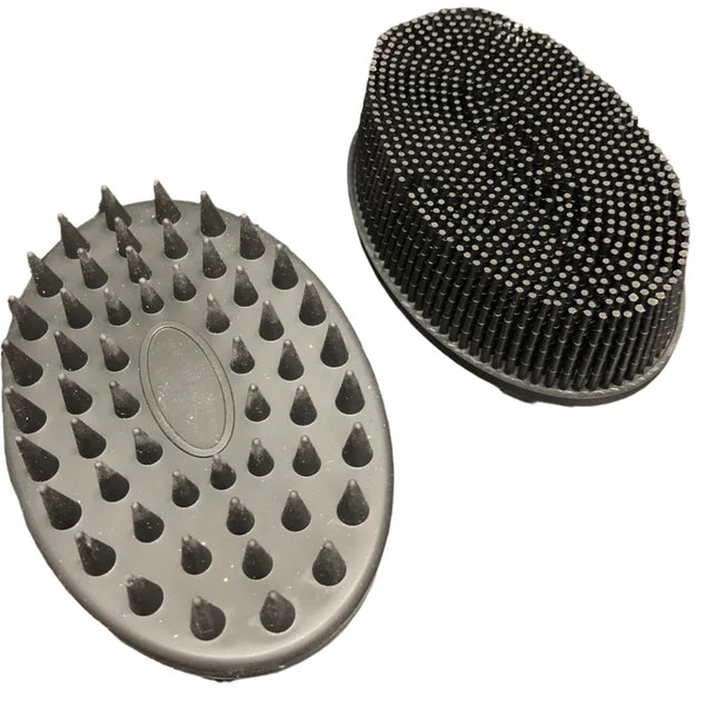 Black Tactile Sensory Brush with varied textured bristles for sensory stimulation and fidget use, black oval design.