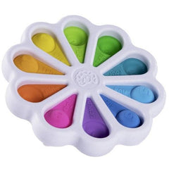 Dimpl Digits sensory toy with colorful silicone buttons shaped like flower petals in a white plastic frame